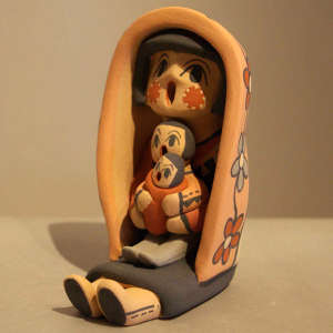 Two children on a female storyteller