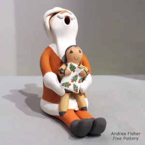 1 child on a Santa Claus storyteller figure