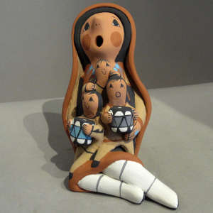 Three children on a polychrome storyteller