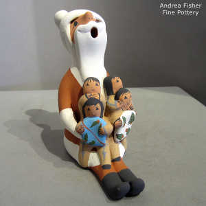 4 children on a Santa Claus storyteller