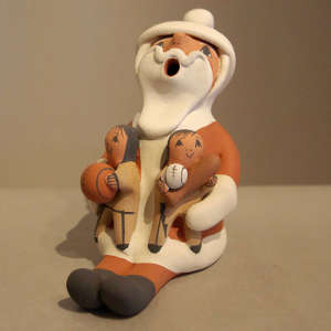 Two children on a Santa Claus storyteller