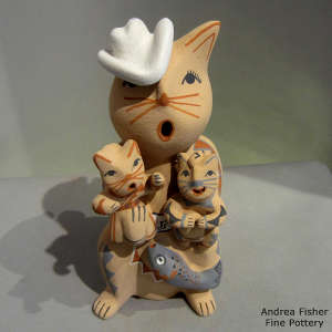 2 kittens and a fish on a feline storyteller