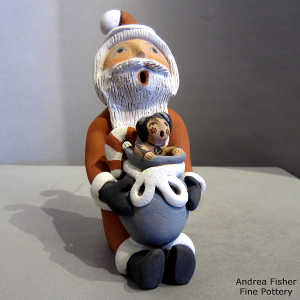 Child in a bag on a Santa Claus storyteller