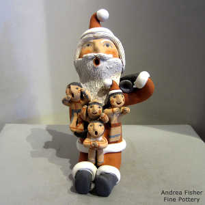 4 children on a Santa Claus storyteller