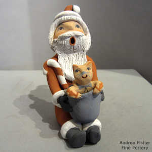Cat in a pot on a Santa Claus storyteller