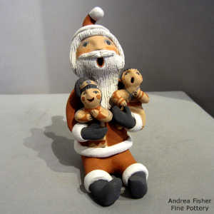 2 children on a Santa Claus storyteller