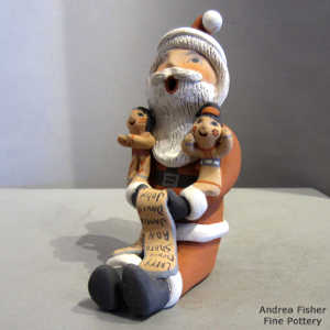 2 children on a Santa Claus storyteller