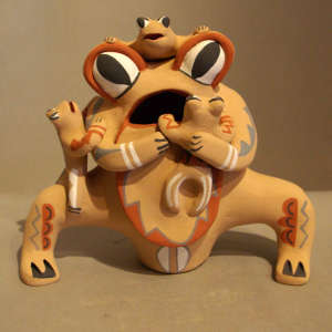 Three children on a frog storyteller