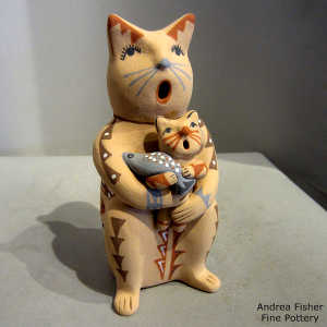 Kitten and a fish on a feline storyteller