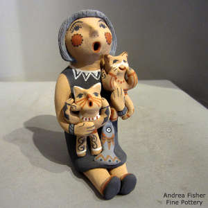 2 kittens and a fish on a grandmother storyteller