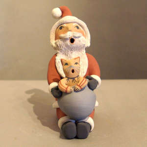 One kitten on a Santa Claus storyteller