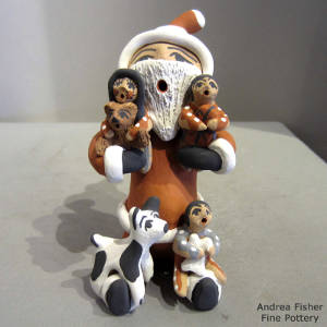 Three children and two puppies on a Santa Claus storyteller
