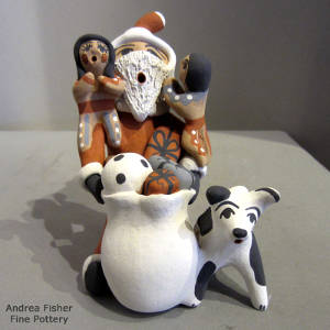 Two children and a puppy on a Santa Claus storyteller