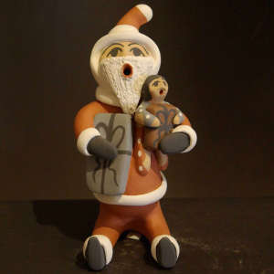 One child and two gifts on a Santa Claus storyteller