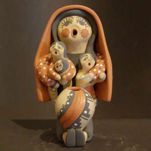 Three children and a pot on a grandmother storyteller in a manta