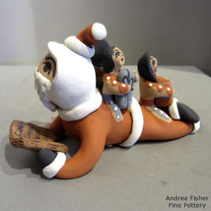 3 children on a Santa Claus storyteller