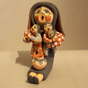 Three children on a polychrome storyteller