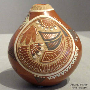 Sgraffito corn, feather and geometric designs decorate a polychrome seedpot