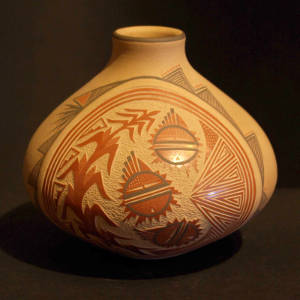 Sgraffito sunface, corn plant and geometric designs on a polychrome buff-colored jar