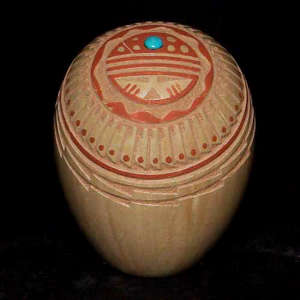 Sgraffito and painted feather and geometric design with an inlaid stone on a polychrome seed pot