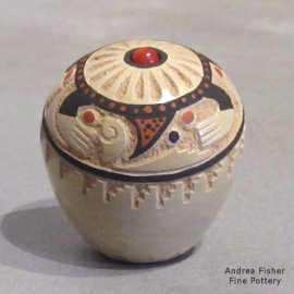 A sgraffito and painted ears of corn and geometric design decorated this miniature polychrome seed pot