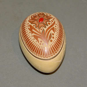 Sgraffito feather and flower design with inlaid coral on an egg-shaped polychrome seedpot