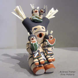 Four children on a koshare storyteller