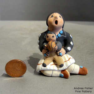 One child and a ball with a miniature bridesmaid