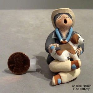 Puppy on a singing grandfather figure