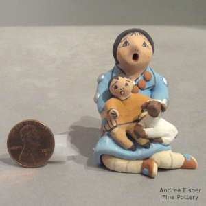 One child and a lamb on a miniature grandmother storyteller