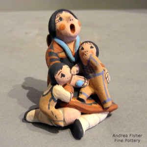 2 children on a miniature grandmother storyteller