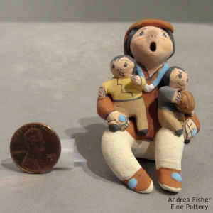 2 children on a miniature grandfather storyteller