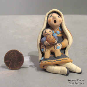 1 child on a miniature grandmother storyteller wearing a manta