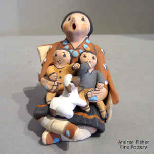 2 children and a lamb on a grandmother storyteller