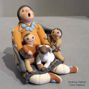 2 children and a lamb on a miniature grandmother storyteller