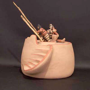 Ladder and 2 koshares on a kiva