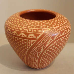 Sgraffito kiva step and geometric design on a polished red jar