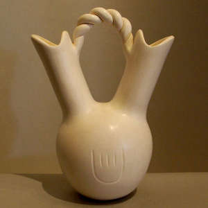 Twisted handle and bear paw imprints on a white wedding vase