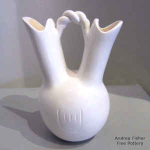 Bear paw imprints and a twisted handle on a white wedding vase