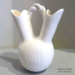 Bear paw imprints and a twisted handle on a white wedding vase