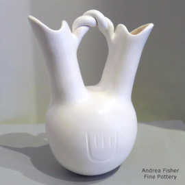 Bear paw imprints and a twisted handle on a white wedding vase