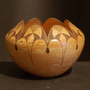 Black fine line, cloud and geometric designs on a Mixed clay bowl with a scalloped rim