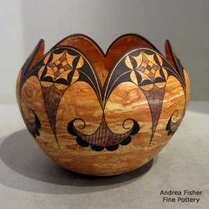 Black geometric design on a Mixed clay jar with a scalloped rim