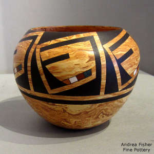 A male kachina design on a Mixed clay jar