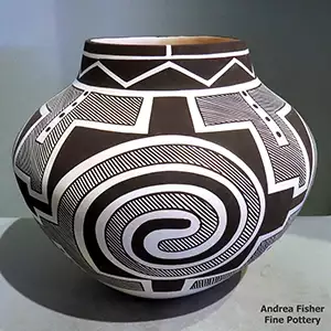 A 4-panel Tularosa spiral and geometric design in black on a white jar
