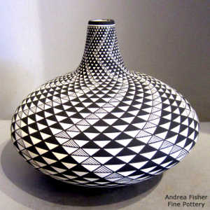 Black and white swirl geometric design on a tall neck jar