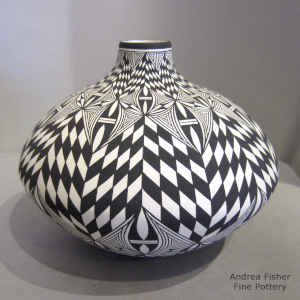 Black and white jar with checkerbord and geometric design
