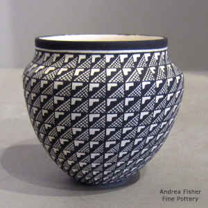 Geometric design on a miniature black and white jar