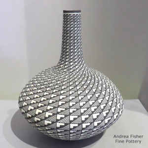 Spiral mesa and geometric design on a tall neck black and white seed pot