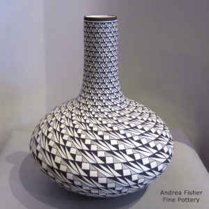 Spiral design on a tall neck black and white jar